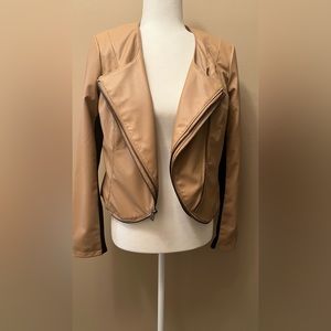 Tan leather jacket with double zippers.
